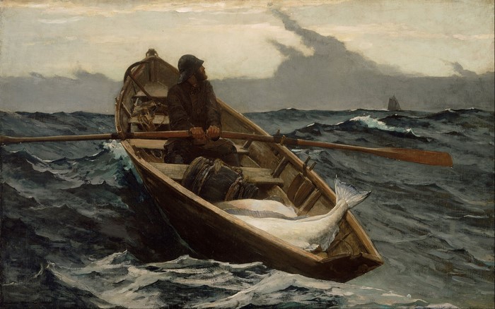 Fisherman rowing a boat with a large fish