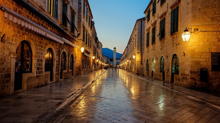 Dubrovnik street at sunrise with marble pavement and lights