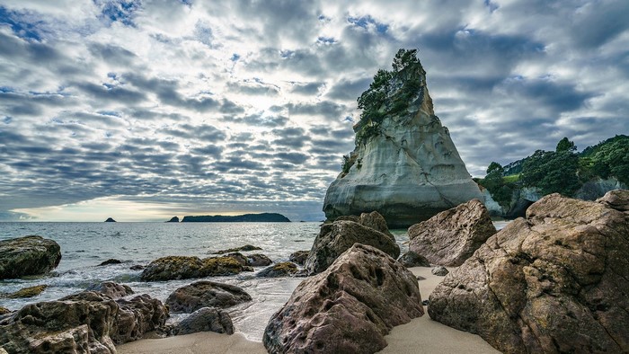 Cathedral Cove, New Zealand Coastline with Rocks and Clouds