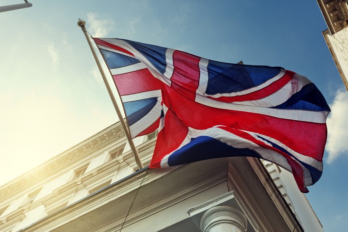Union Jack flag waving in front of a building