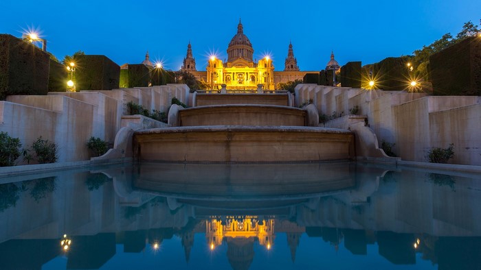 Palau Nacional building with fountains and reflection in Barcelona