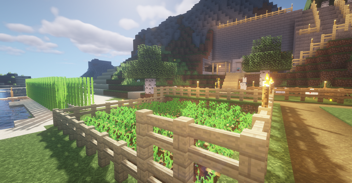 Minecraft screenshot of a farm and house