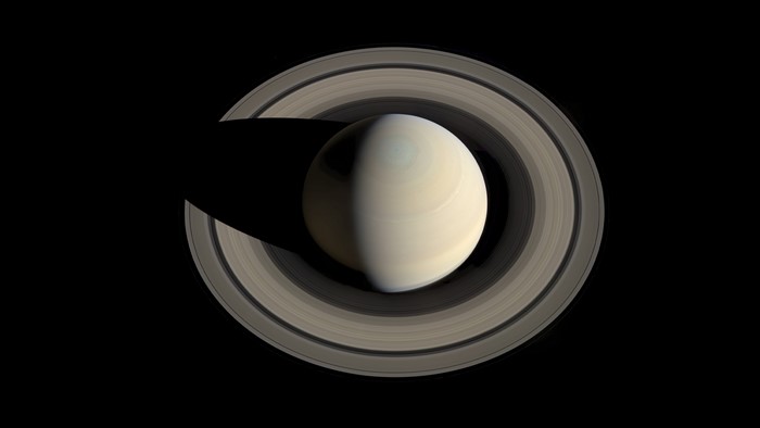 Saturn and its rings in space