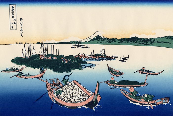 Boats on the water with Mount Fuji in the background