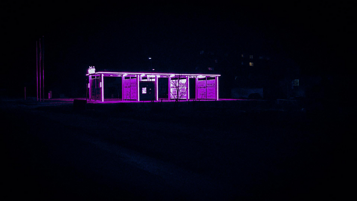Car wash at night with purple neon lights