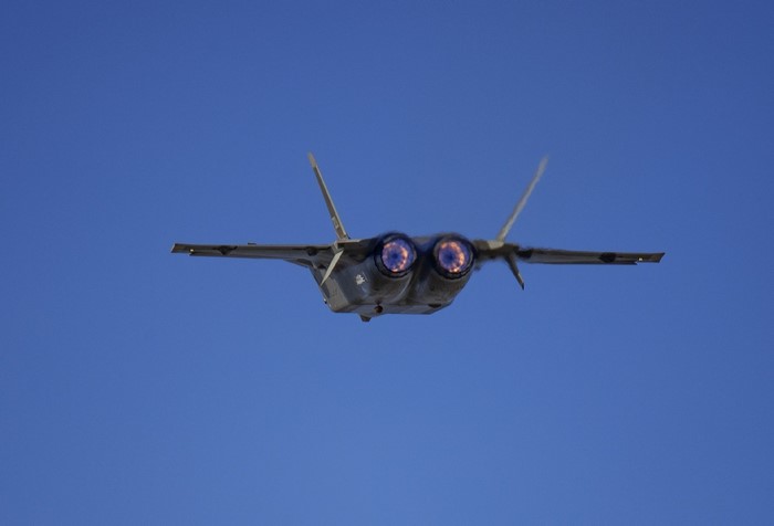 Rear view of a J-20 fighter jet in flight