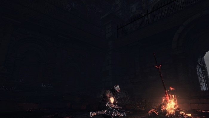 Knight resting by a bonfire in Dark Souls 3