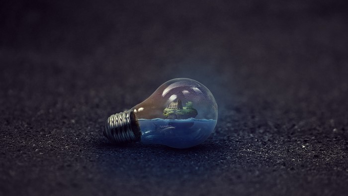Lightbulb with island and ship inside
