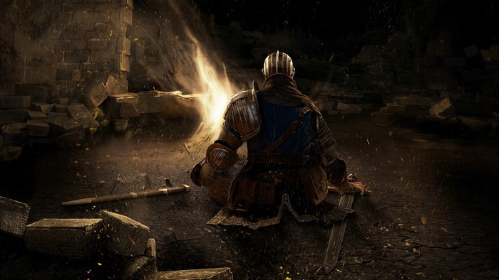 Knight sitting by a bonfire in Dark Souls