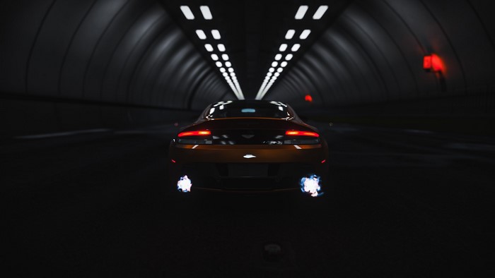 Aston Martin Vantage S driving through a tunnel