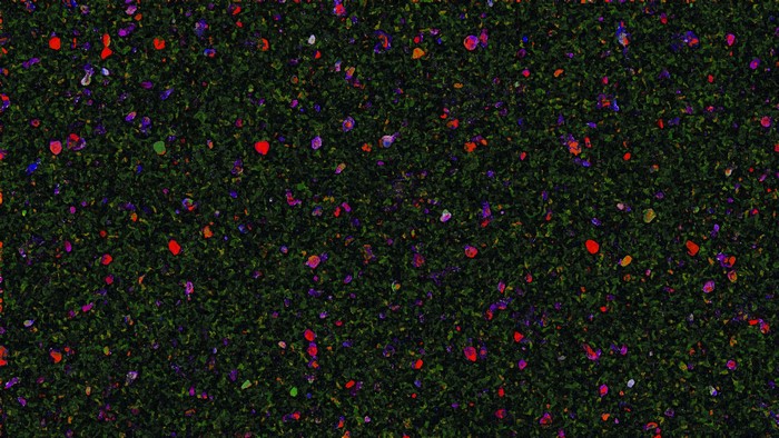 Abstract pattern of green leaves with colorful speckles