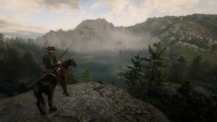 Man on horse in Red Dead Redemption 2 landscape