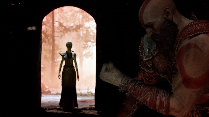 Kratos and a figure in a doorway in God of War