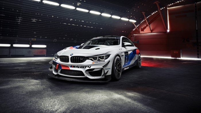 BMW M4 GT4 race car in hangar