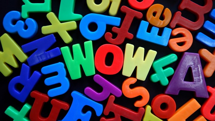 Colorful plastic letters spelling WOW