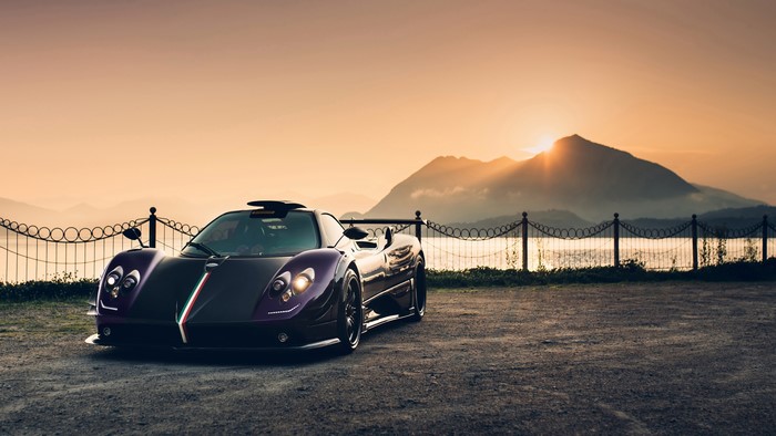4K Pagani Zonda supercar at sunset with mountains