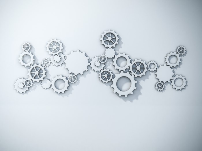 Minimalist artwork of interlocking gears