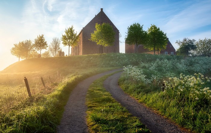 Church on a hill with a dirt road in the Netherlands