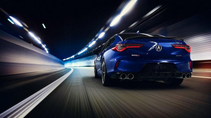 Blue Acura TLX driving through a tunnel