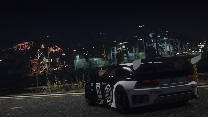 GTA V: Modified sports car at a nighttime industrial port