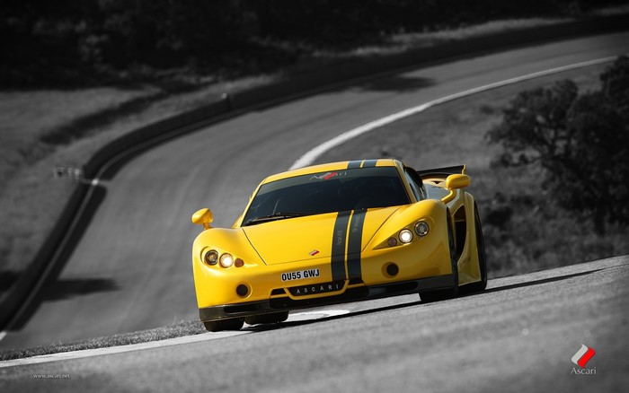 Yellow Ascari KZ1-R race car on a track