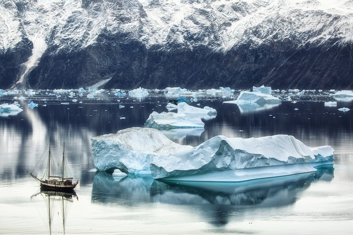 Sailboat and icebergs in Greenland