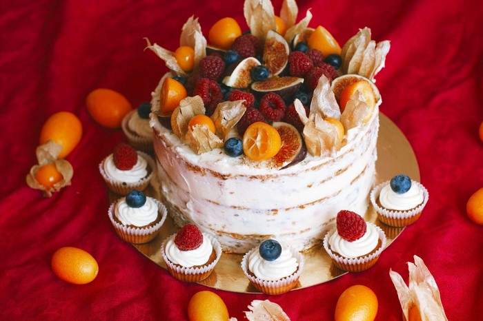 Naked cake with berries and fruits