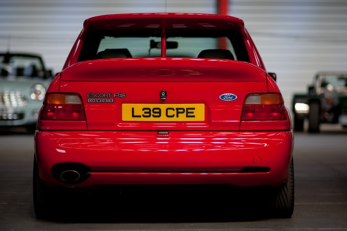 Red Ford Escort RS Cosworth with license plate L39 CPE