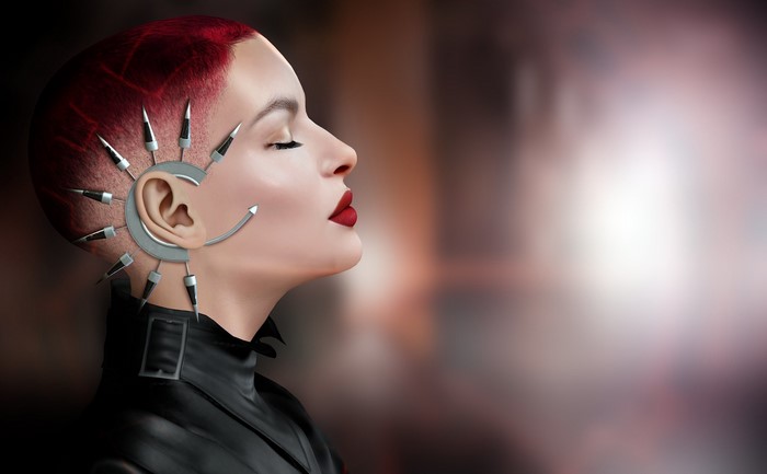 Woman with cybernetic ear implants and red hair
