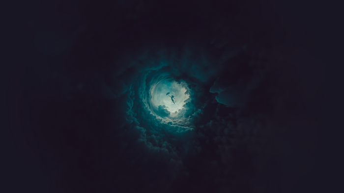 Silhouette of a person with an umbrella falling through clouds