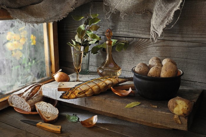 Still life with bread, potatoes, fish, and knife