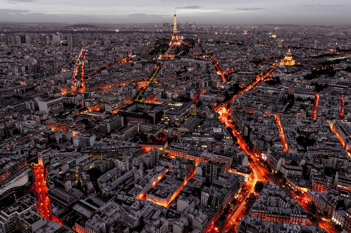 Aerial view of Paris at night with Eiffel Tower