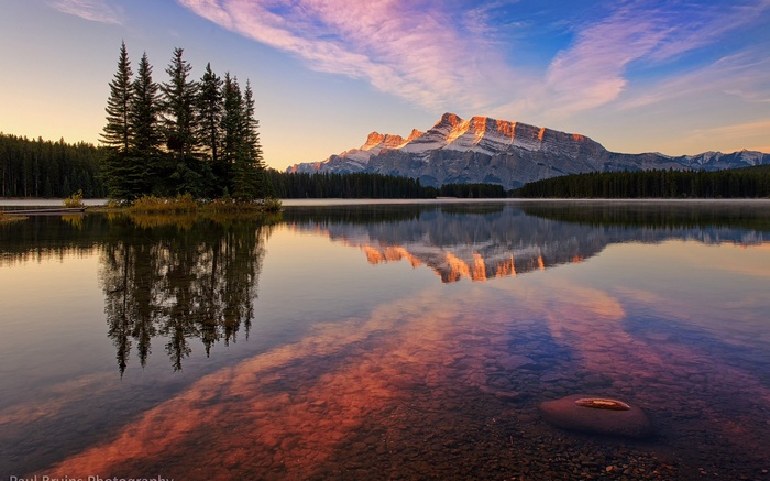 Mountain reflection on a lake at sunrise