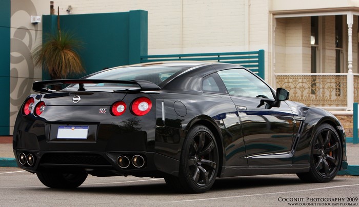 Black Nissan GT-R parked outside building