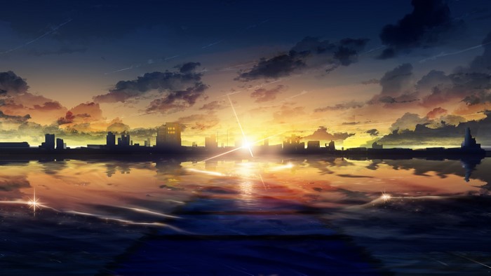 City skyline at sunset reflected in water