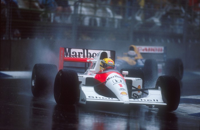 Ayrton Senna driving a McLaren MP4/4 in the rain