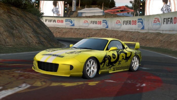 Yellow Mazda RX-7 FD with Dragon Decals on FIFA 08 Track