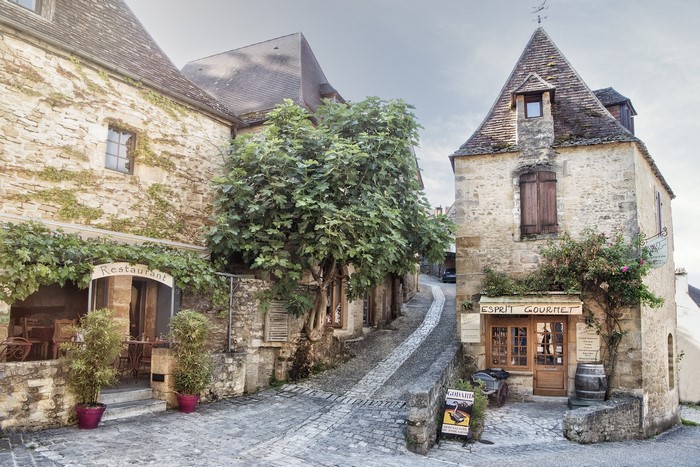 Cobblestone street with stone buildings in a French village