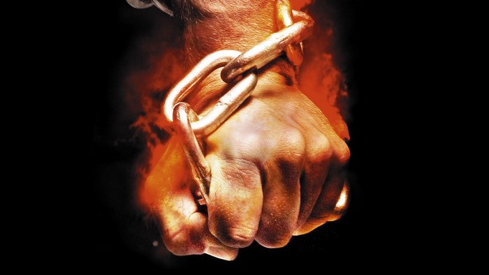 Fist with chains and fire