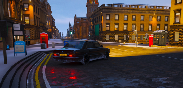 BMW in snowy town street