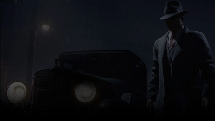 Vito Scaletta from Mafia II standing by a car