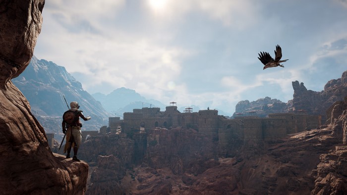 Bayek from Assassin's Creed Origins overlooking a fortress