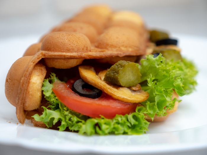 Bubble waffle sandwich with vegetables and mushrooms
