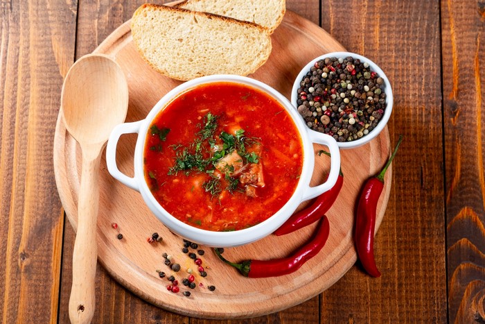 Borscht soup with bread, peppers, and spices