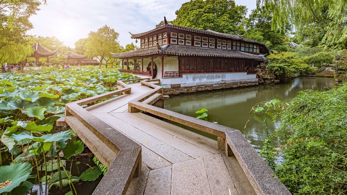 Asian architecture in a Chinese garden with lotus pond