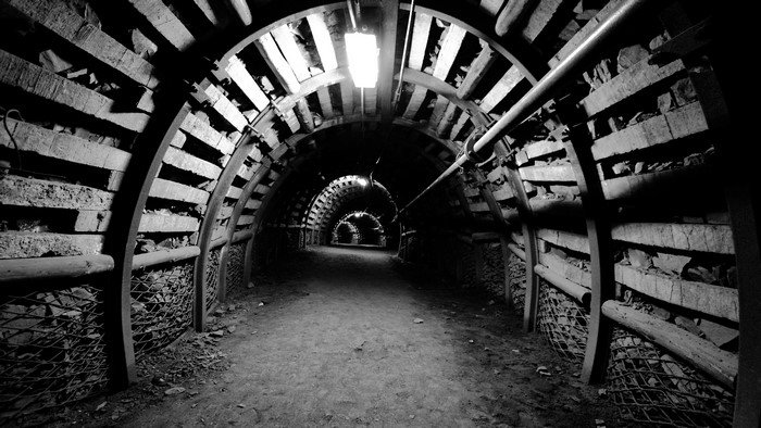 Abandoned monochrome mine tunnel underground