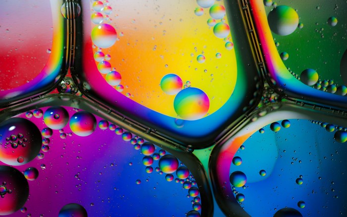 Colorful oil and water bubbles with rainbow reflections