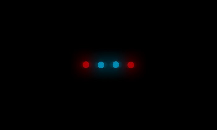 Four glowing dots, two red and two blue