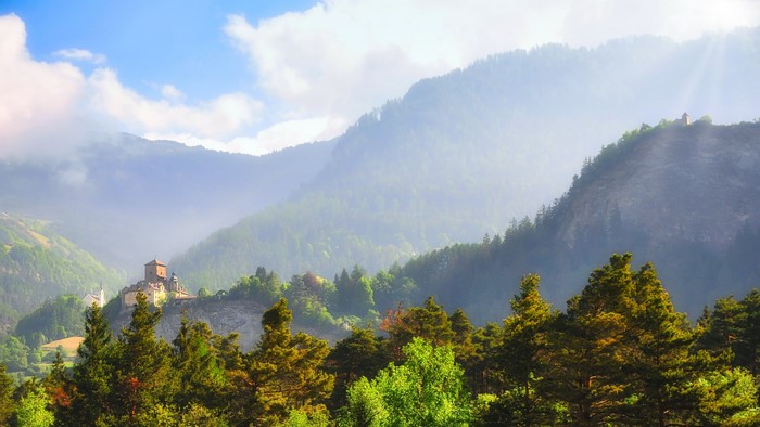Castle Ortenstein on a mountain in Switzerland with sunlight
