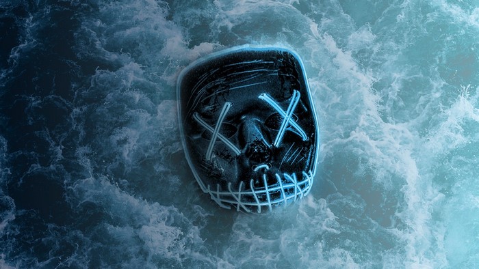 The Purge Neon Mask Floating on Water